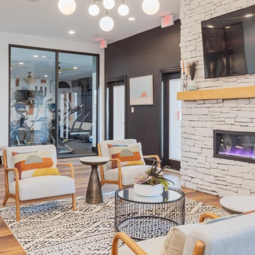 a club room with a fireplace