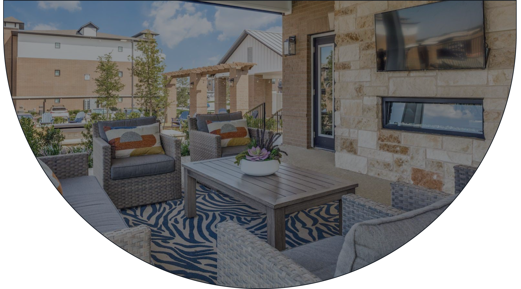 an outdoor lounge space with a media area