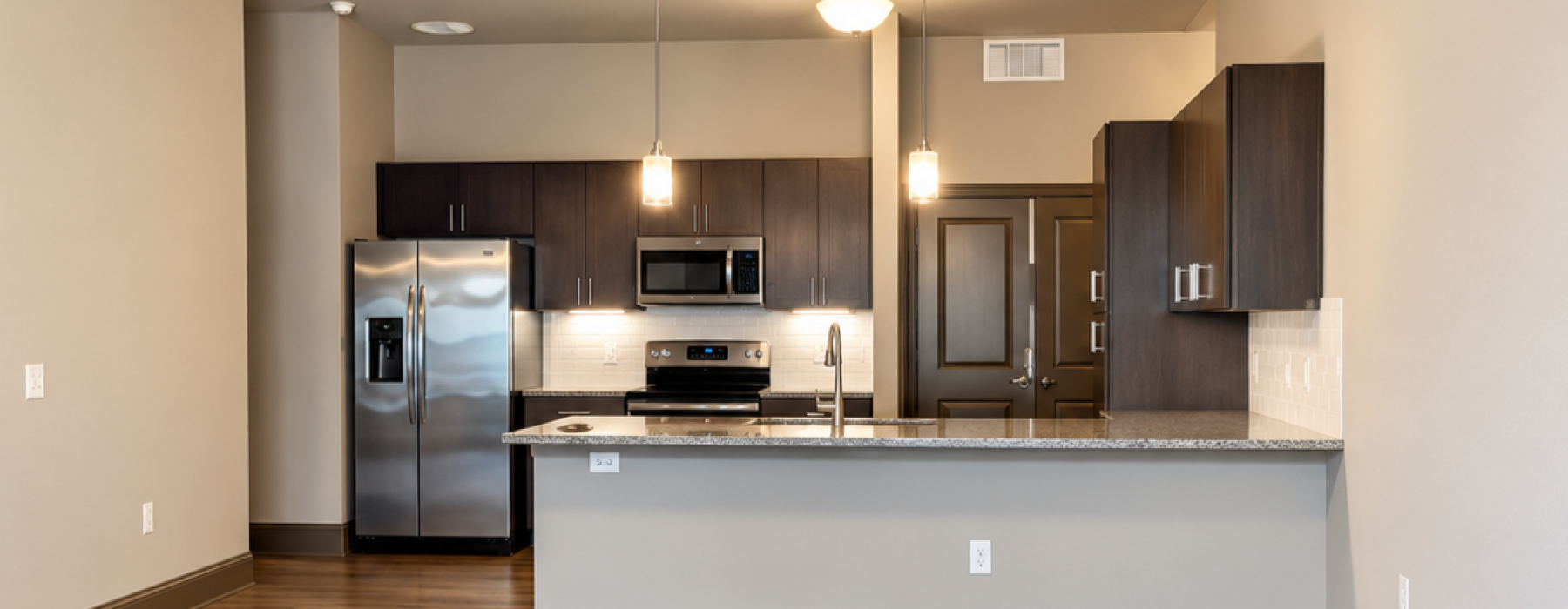 Open living area and kitchen in 3 bedroom apartment at Reatta Ranch in Justin TX