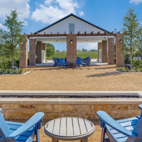 a fire pit with chairs